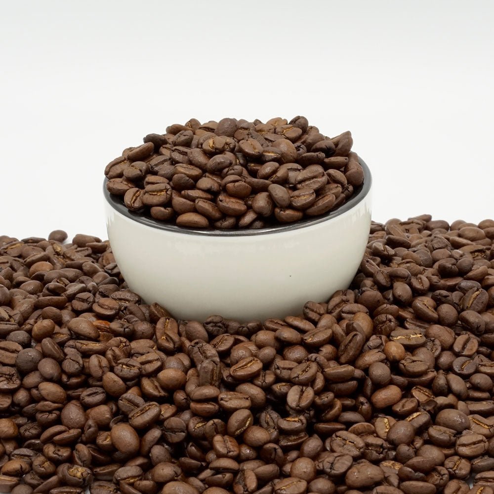 Black coffee bag labeled 'Espresso Hausblend' with brewing information