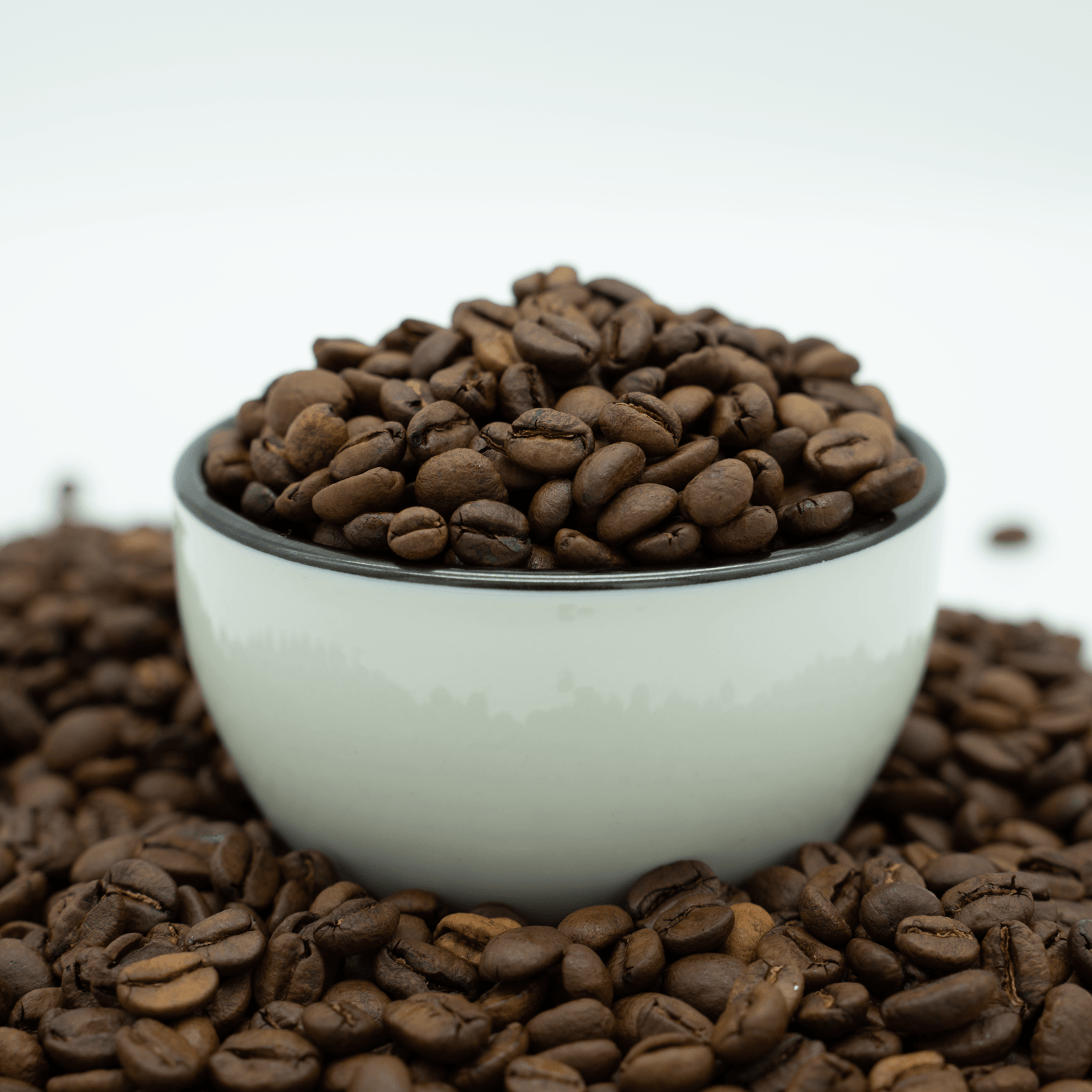 Black coffee bag with label detailing product information and certifications.